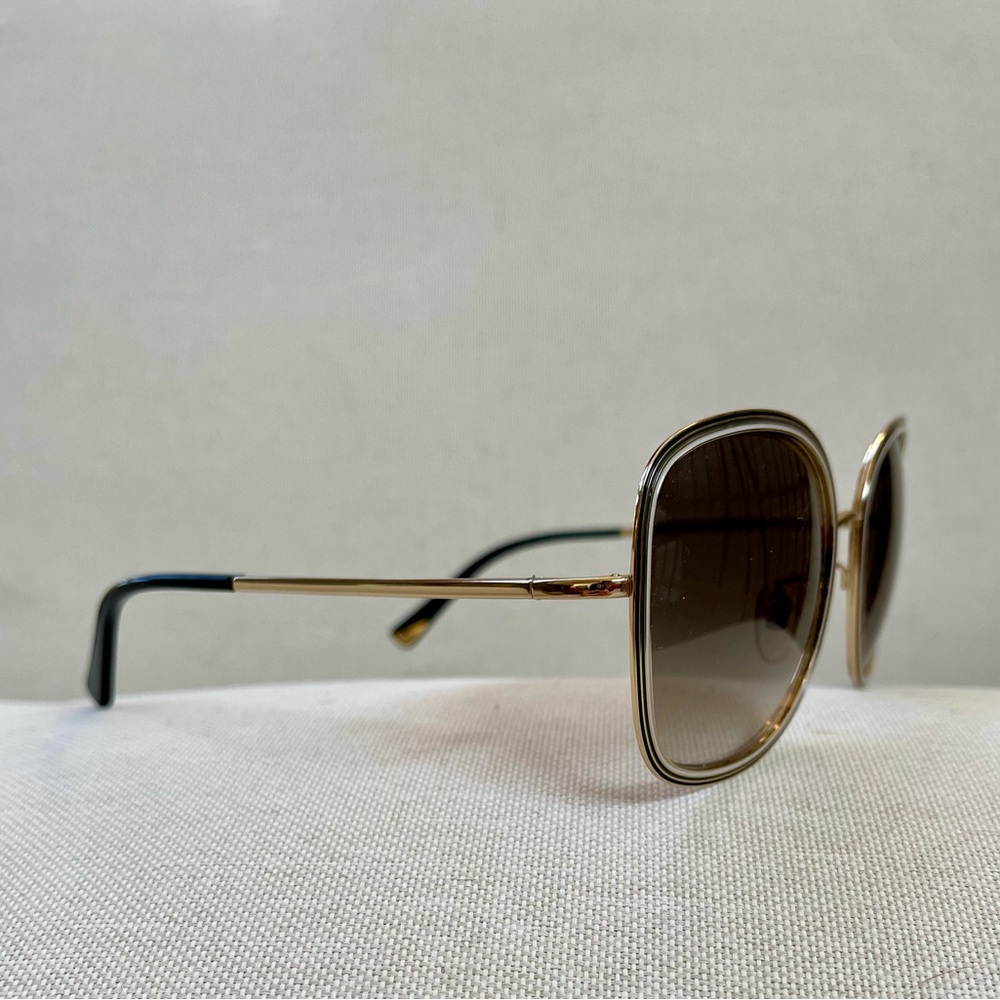 Nina Ricci sunglasses in a 58 eye. Brand new. Brw/gold with wht tracing on front